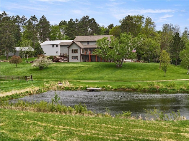6167 24th St SW, Pine River, MN 56474 - rear view of house with a yard and a water view