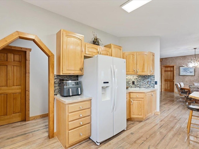 6167 24th St SW, Pine River, MN 56474 - kitchen with white refrigerator with ice dispenser, light countertops, light wood-style flooring, and light brown cabinets
