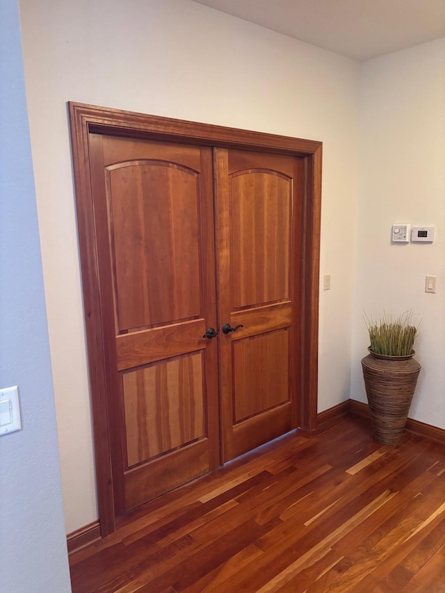 interior details with wood finished floors and baseboards