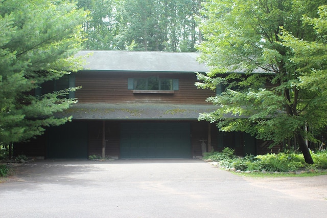 exterior space with driveway and an attached garage