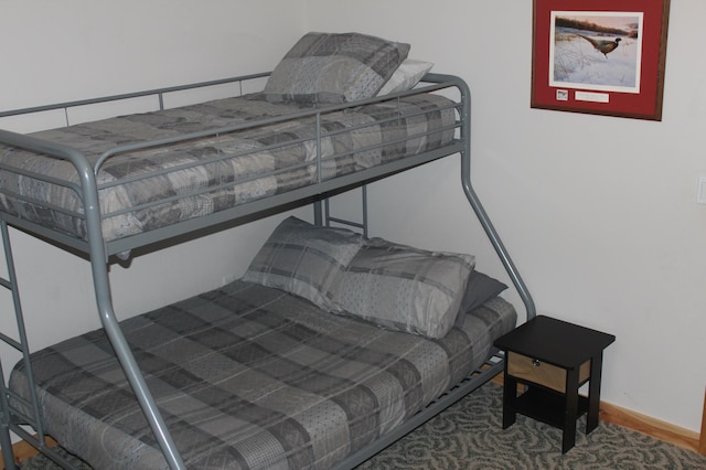 bedroom featuring baseboards