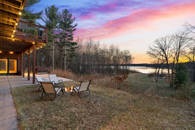 7251 County Rd B, Siren Twp, WI 54872 - view of yard featuring a fire pit, a deck with water view, a hot tub, and a patio