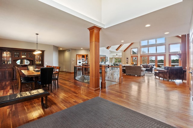 7251 County Rd B, Siren Twp, WI 54872 - dining space featuring wood-type flooring, ornate columns, and recessed lighting
