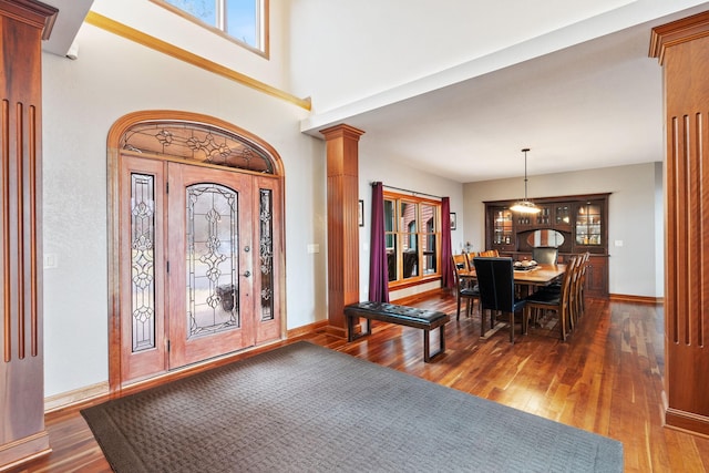 7251 County Rd B, Siren Twp, WI 54872 - foyer with baseboards, ornate columns, and hardwood / wood-style flooring
