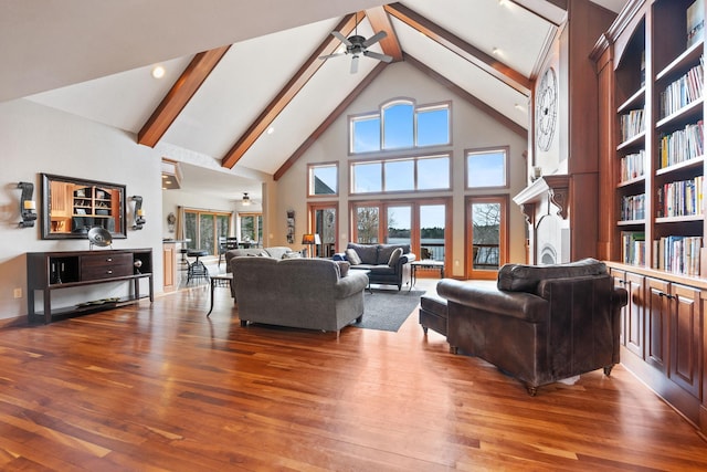 7251 County Rd B, Siren Twp, WI 54872 - living room with beamed ceiling, wood finished floors, and ceiling fan