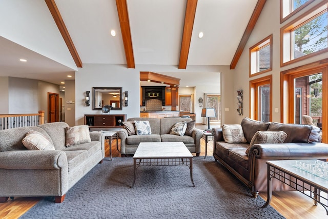 7251 County Rd B, Siren Twp, WI 54872 - living room featuring high vaulted ceiling, beam ceiling, wood finished floors, and recessed lighting