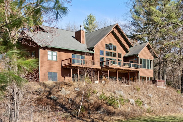 7251 County Rd B, Siren Twp, WI 54872 - rear view of property with a chimney and a deck