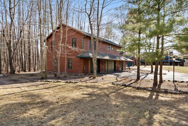 7251 County Rd B, Siren Twp, WI 54872 - back of property featuring an attached garage