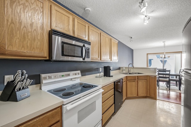 kitchen with white electric range oven, a peninsula, a sink, black dishwasher, and stainless steel microwave