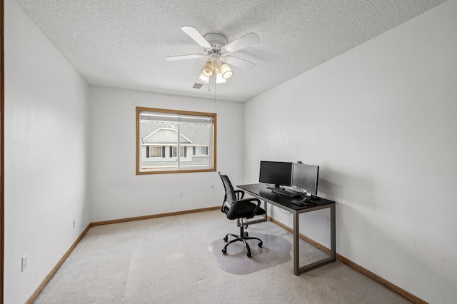 office space with visible vents, baseboards, carpet, and a textured ceiling