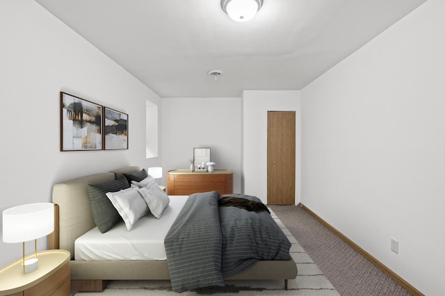 bedroom featuring visible vents, baseboards, and carpet floors