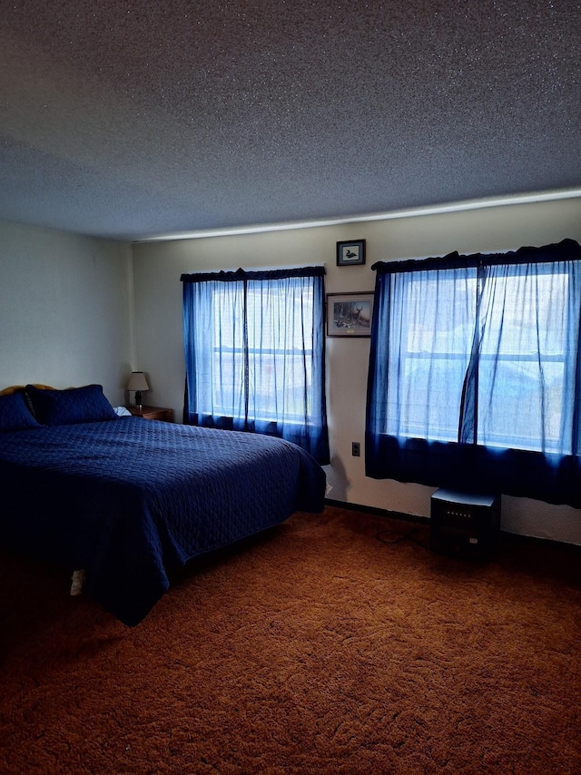 unfurnished bedroom featuring carpet floors and a textured ceiling