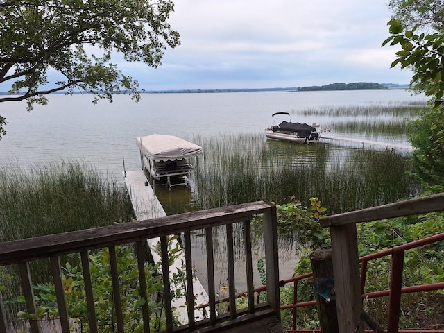 dock area featuring a water view and boat lift