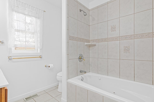 full bathroom featuring baseboards, visible vents, tile patterned flooring, tiled shower / bath combo, and toilet