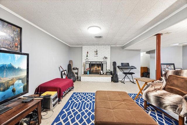 living area with a fireplace, visible vents, and crown molding