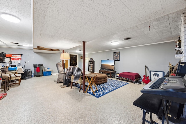 interior space with carpet floors, ornamental molding, and visible vents