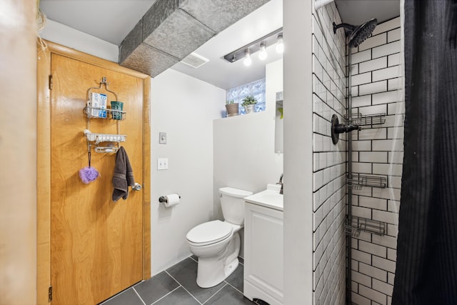 bathroom featuring tile patterned flooring, visible vents, vanity, and toilet