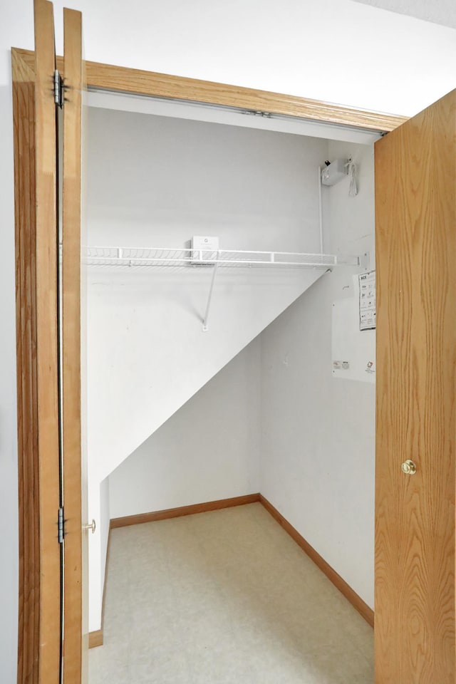 spacious closet with tile patterned floors