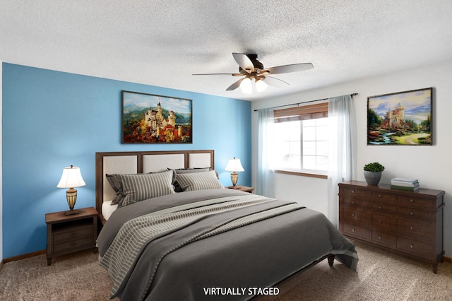 bedroom featuring carpet flooring, ceiling fan, a textured ceiling, and baseboards