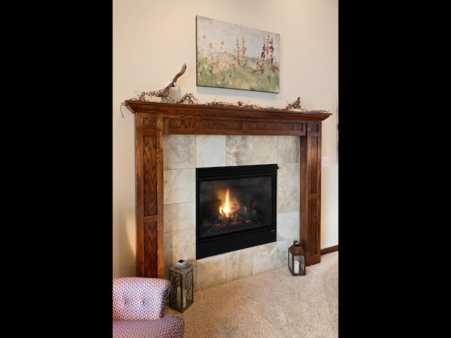 room details featuring carpet floors, a fireplace, and baseboards