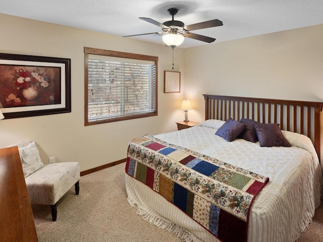 bedroom with carpet, ceiling fan, a textured ceiling, and baseboards