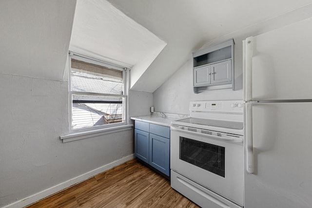 kitchen with dark wood finished floors, blue cabinetry, lofted ceiling, white appliances, and baseboards