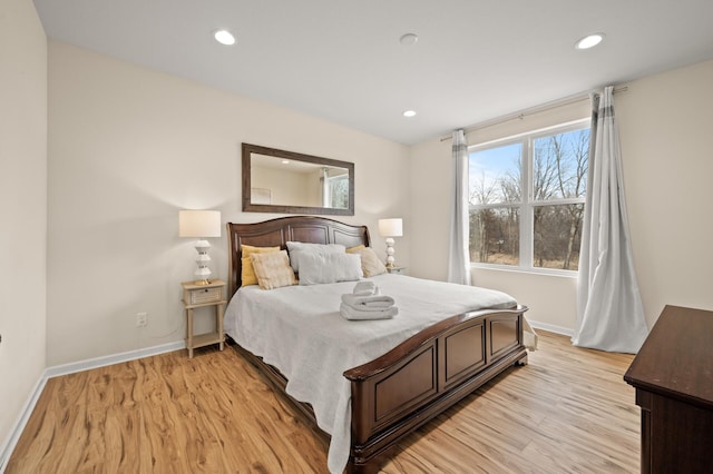 bedroom featuring recessed lighting, light wood-type flooring, and baseboards