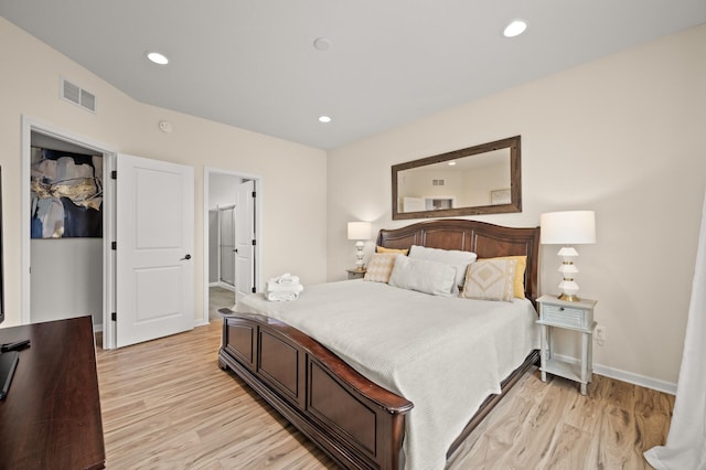 bedroom featuring recessed lighting, light wood-style floors, and visible vents