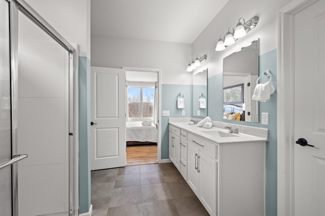 full bathroom featuring a sink, a healthy amount of sunlight, and connected bathroom