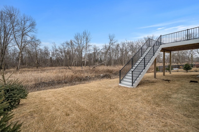 view of yard with stairway and a wooden deck