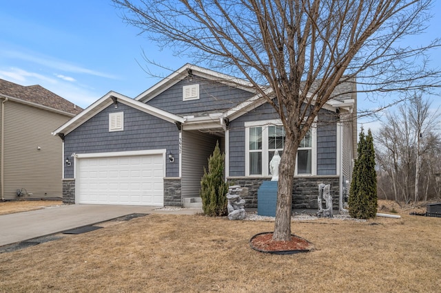 craftsman-style house with stone siding, concrete driveway, a garage, and a front yard