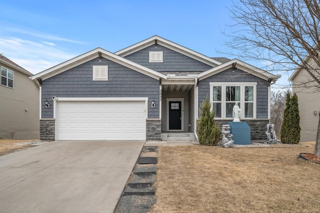 craftsman house featuring a garage, stone siding, and driveway