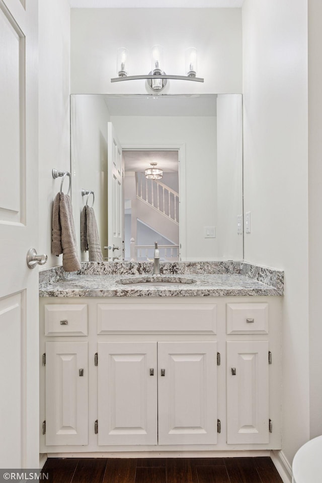 bathroom with vanity and wood finished floors