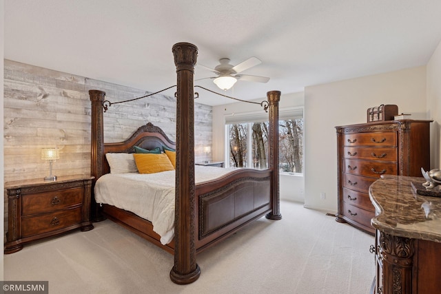 bedroom with light carpet and a ceiling fan