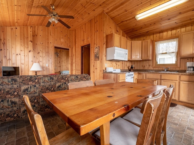 dining area featuring lofted ceiling, wooden ceiling, and wooden walls