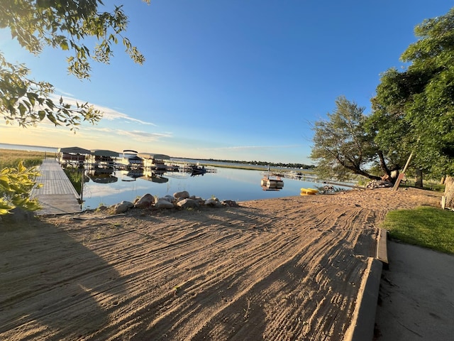 property view of water with a dock