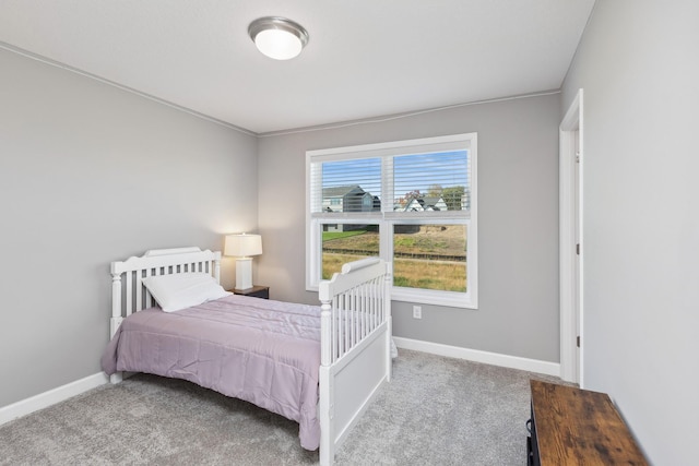 carpeted bedroom with baseboards