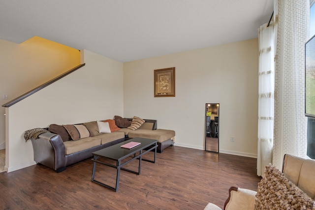 living room with wood finished floors and baseboards