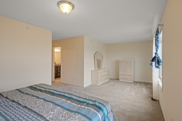 bedroom with a textured ceiling, carpet, and baseboards