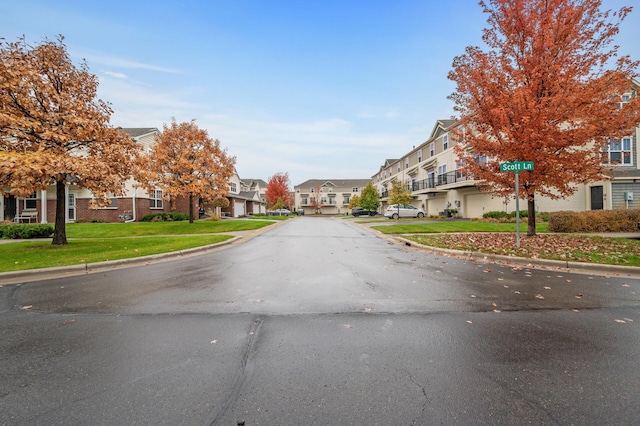 view of road with curbs and a residential view