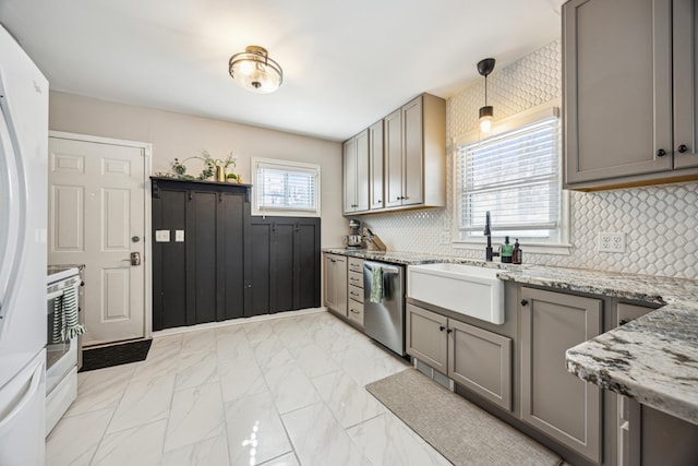 kitchen featuring gray cabinetry, a sink, marble finish floor, stainless steel dishwasher, and light stone countertops