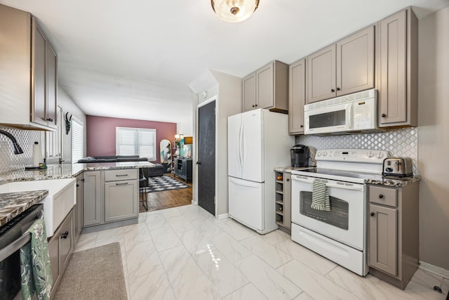 kitchen with white appliances, tasteful backsplash, marble finish floor, and gray cabinets