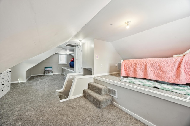 bonus room featuring baseboards, visible vents, vaulted ceiling, and carpet flooring