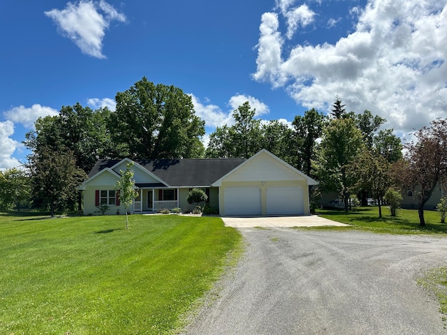 ranch-style house with a garage, a front yard, and driveway