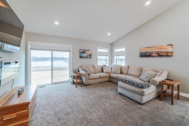 carpeted living room with a wealth of natural light, vaulted ceiling, baseboards, and recessed lighting