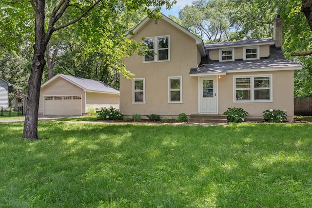 traditional-style home with a garage, a chimney, an outbuilding, a front yard, and stucco siding