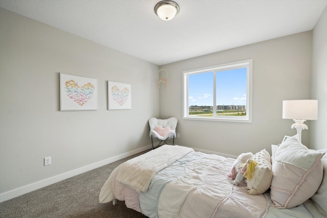 bedroom featuring carpet floors and baseboards