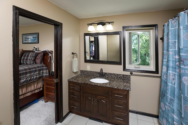 bathroom with vanity, ensuite bath, and tile patterned floors