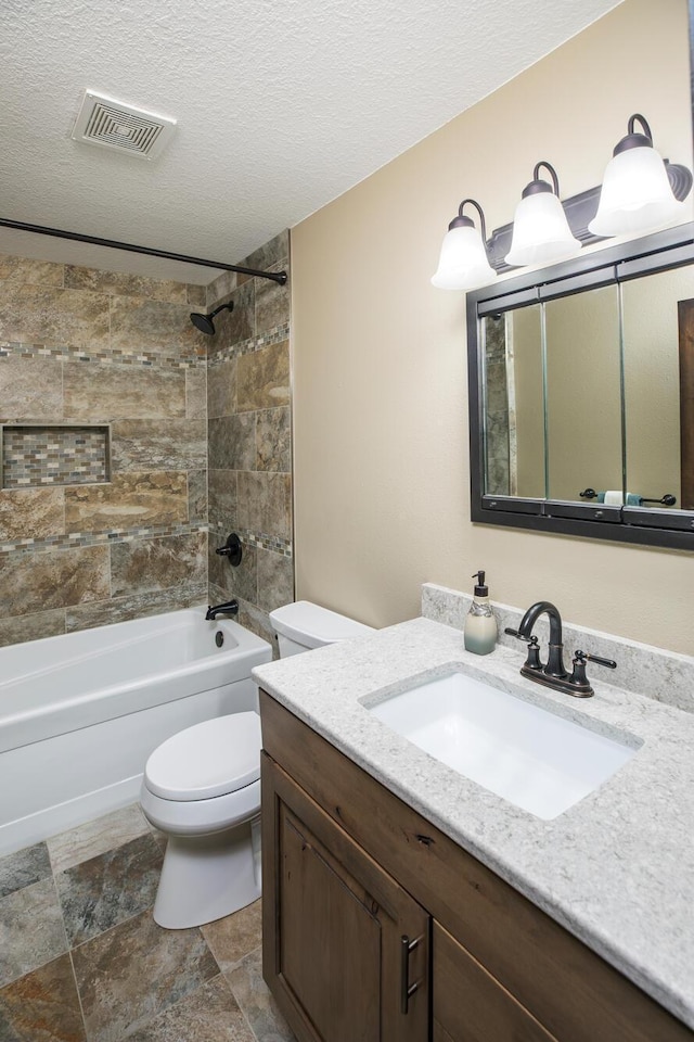 full bathroom with a textured ceiling, shower / tub combination, toilet, vanity, and visible vents