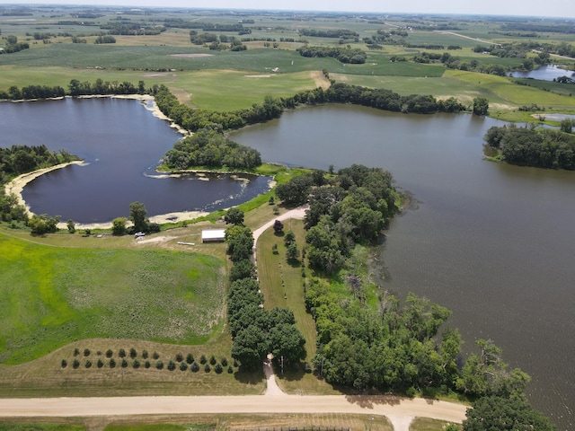 birds eye view of property featuring a water view and a rural view